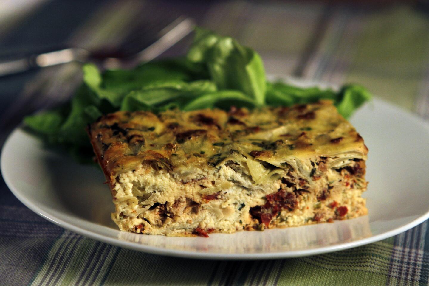 Artichoke and sun-dried tomatoes combine with two types of cheese and fresh herbs in this colorful dish.