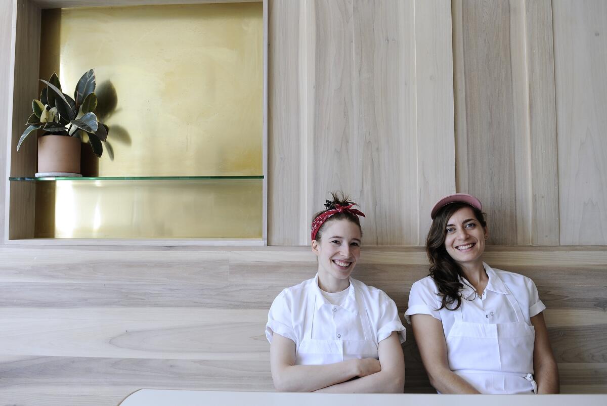 Sarah Hymanson, left, and Sara Kramer are chefs and co-owners of Kismet in Los Feliz. They also run Madcapra in Grand Central Market. (Mariah Tauger / For The Times)