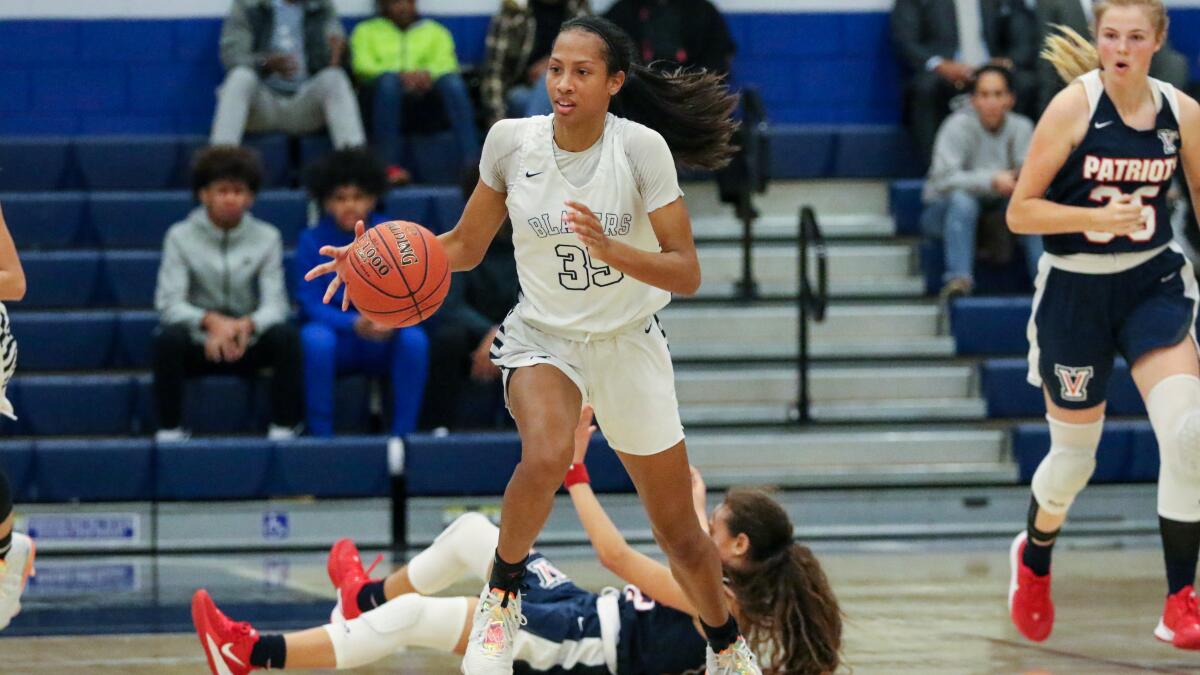 Sierra Canyon's Alexis Mark leads a break after stealing the ball from Viewpoint in the second half of the Trailblazers' 71-49 victory on Wednesday