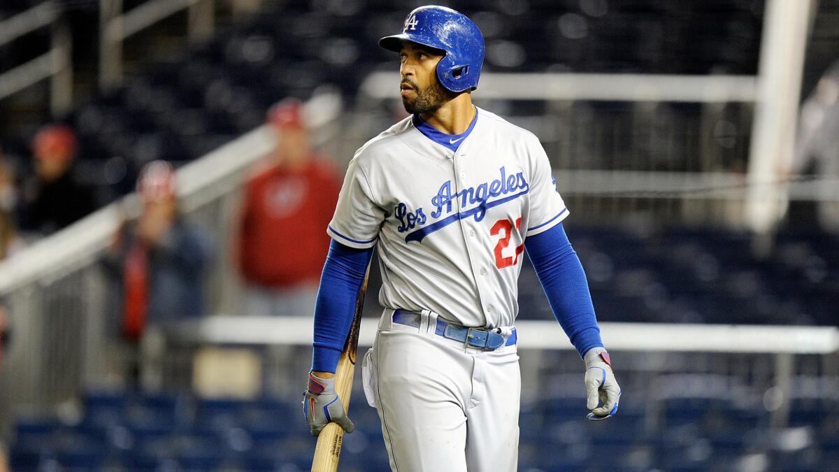 Dodgers center fielder Matt Kemp walks back to the dugout after striking out against the Washington Nationals on May 6. Kemp's defensive struggles have landed him a spot on the bench for the time being.