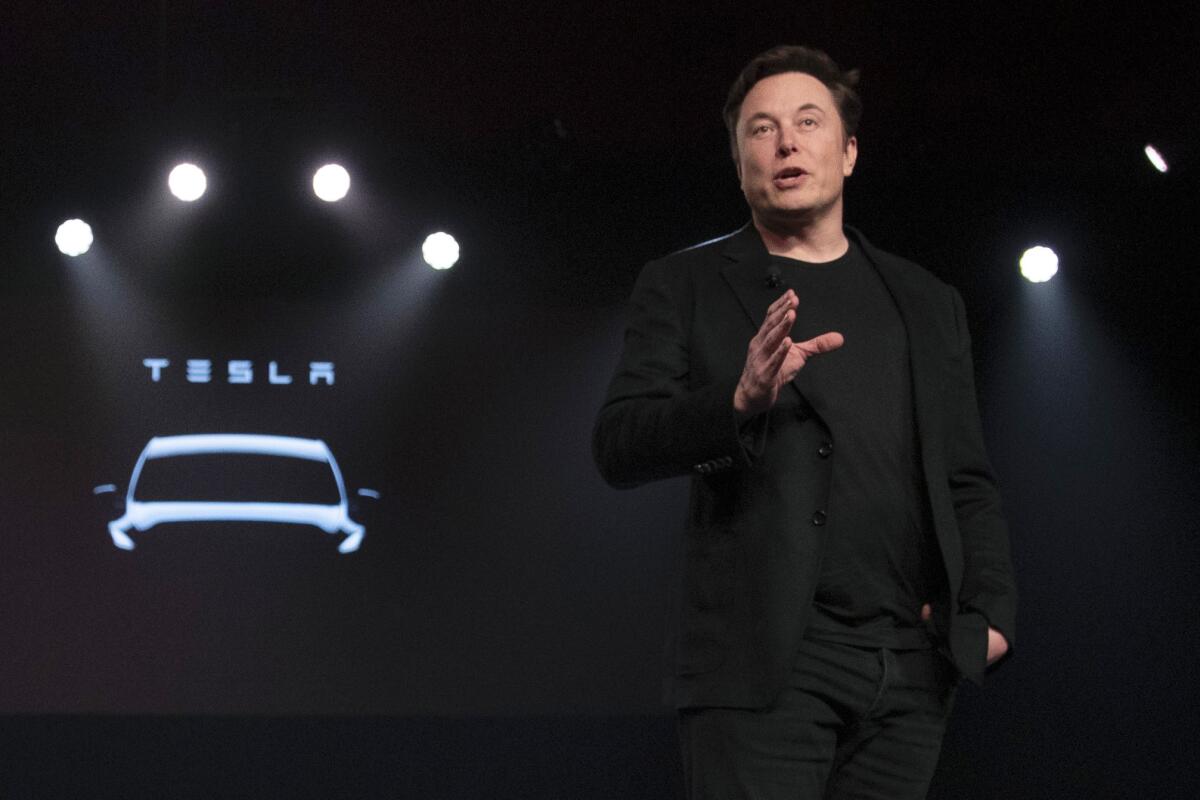 FILE - Tesla CEO Elon Musk speaks before unveiling the Model Y at the company's design studio on March 14, 2019, in Hawthorne, Calif. Musk is selling about 8 million Tesla shares worth nearly $7 billion as the billionaire looks to get his finances in order ahead of his court battle with Twitter. (AP Photo/Jae C. Hong, File)