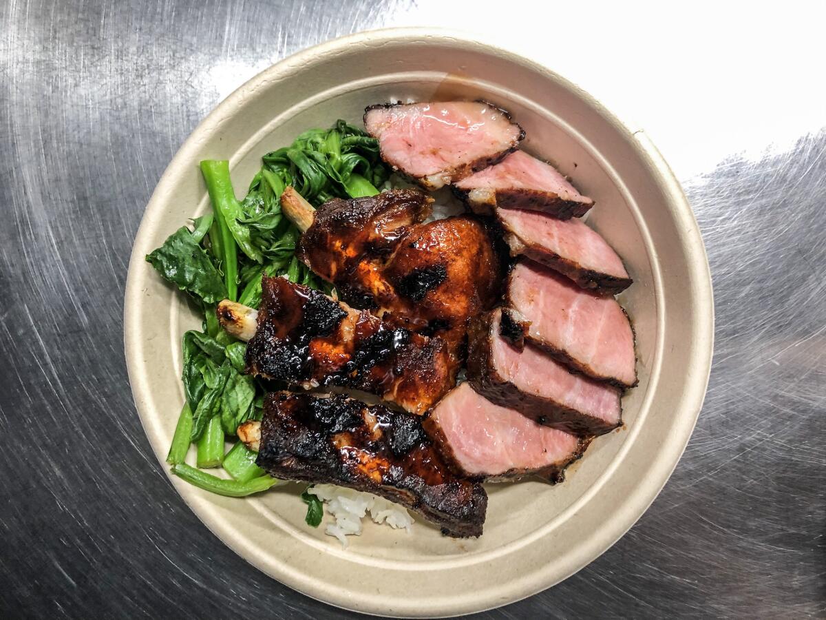 The combination char siu and ribs bowl over rice at Pearl River Deli. 