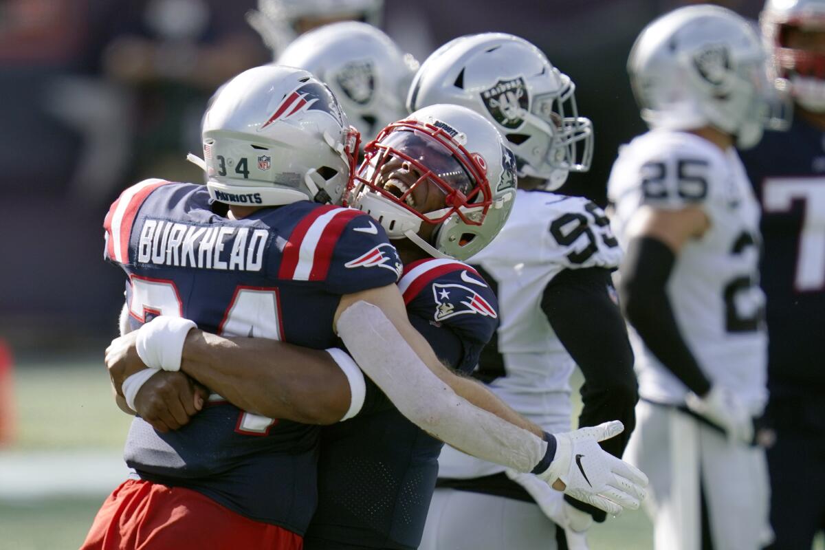 New England Patriots running back Rex Burkhead celebrates with quarterback Cam Newton.