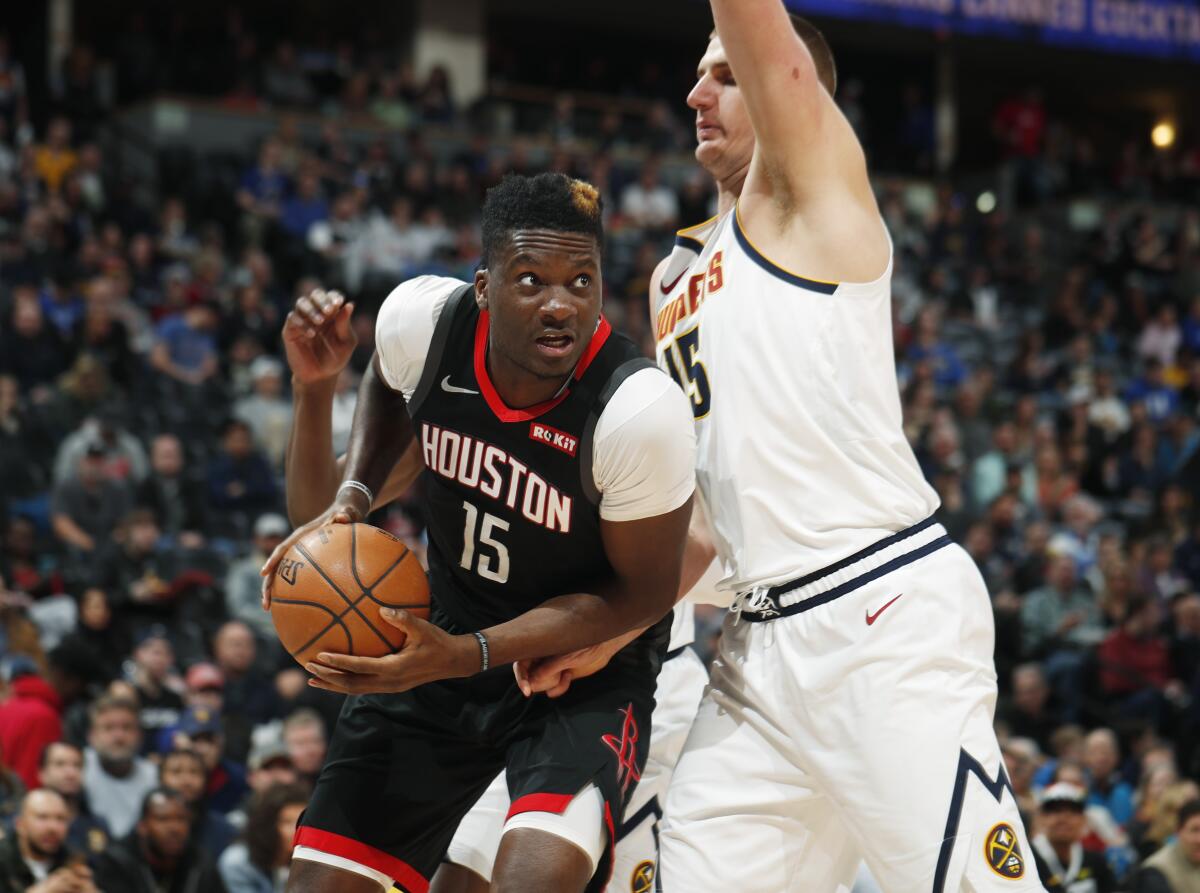 Rockets center Clint Capela drives to the rim against Nuggets center Nikola Jokic during the first half of a game Jan. 26.