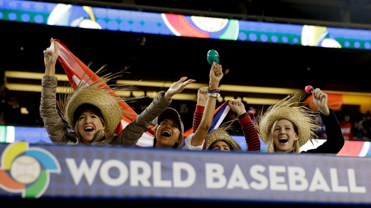 Puerto Rico fans cheer during a World Baseball Classic game against the Netherlands on March 20, 2017, at Dodger Stadium.