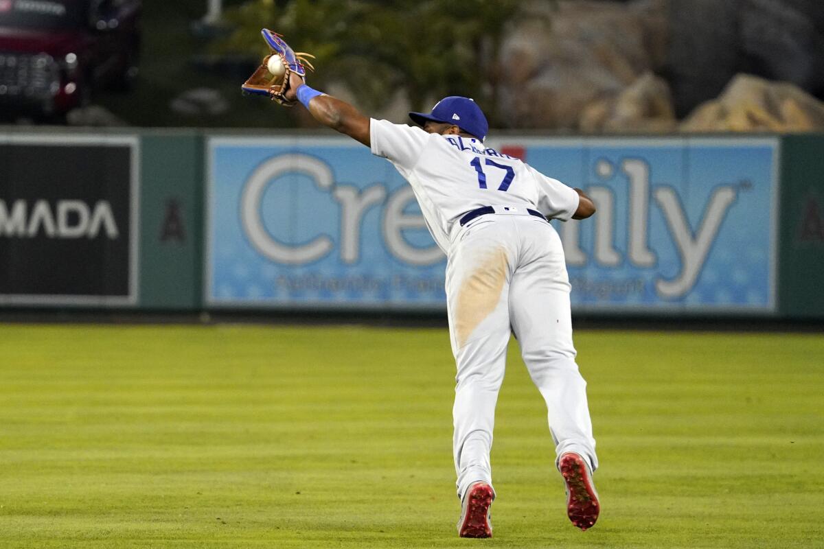 Dodgers second baseman Hanser Alberto catches a fifth-inning line drive hit by the Angels' Jared Walsh on July 15, 2022.