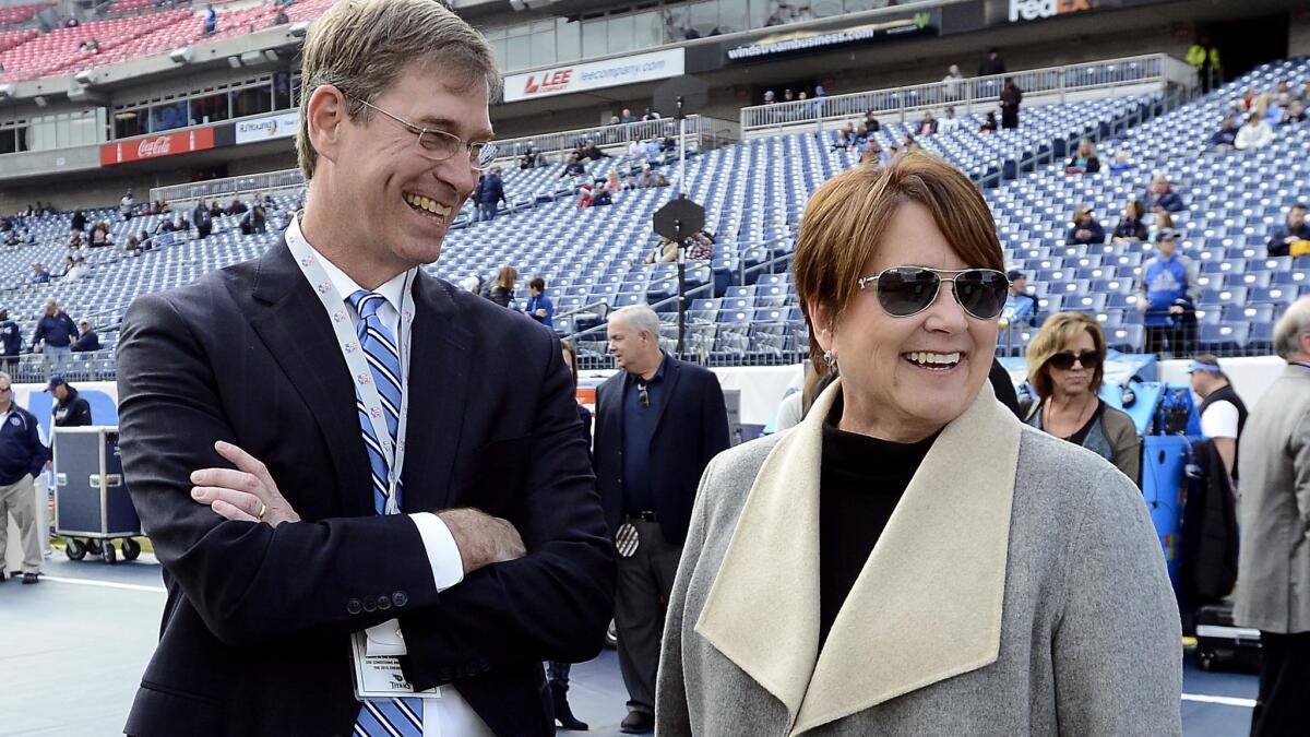 Ruston Webster, left, chats with Tennessee Titans controlling owner Amy Adams Strunk before a game against the Jacksonville Jaguars on Dec. 6 in Nashville.