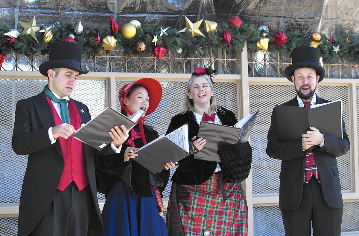 Christmas carolers perform at the Winter Fest at the Orange County Fair and Events Center on Friday.