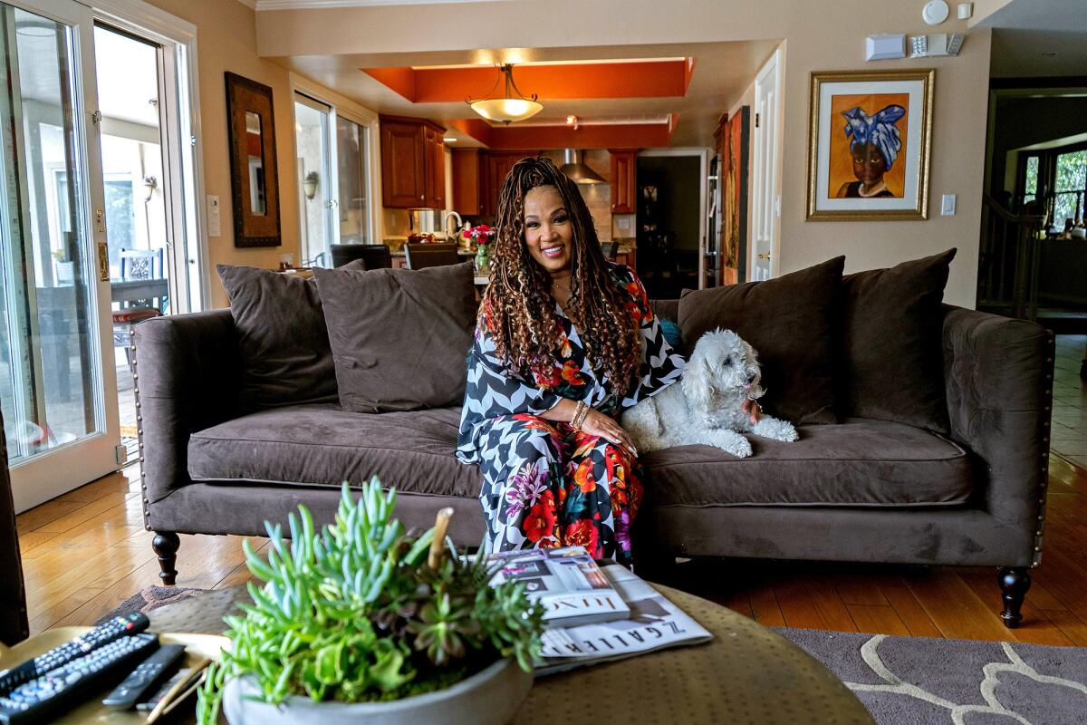 The den, part of the 3,300-square-foot, four-bedroom, three-bath Tudor-style home, is an irresistible draw for Whitley, her 8-year-old son, Joshua, and Milk, an 18-year-old poodle.