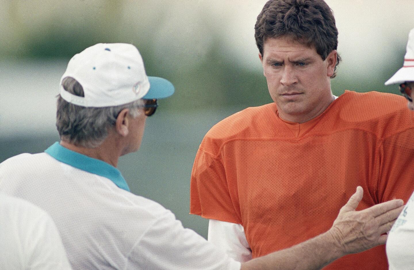 Miami Dolphins coach Don Shula, left, talks with quarterback Dan Marino before practice at St. Thomas University, Wednesday, Jan. 6, 1993, Miami, Fla. The Dolphins will face the San Diego Chargers in an NFC Playoff game on Sunday, January 10. (AP Photo/Dave Bergman)