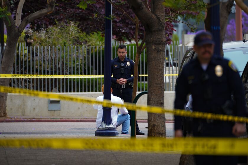 San Diego, CA - May 23: San Diego police officers respond to a reported shooting on K Street between Tenth Avenue and Eleventh Avenue in downtown on Tuesday, May 23, 2023 in San Diego, CA. (Nelvin C. Cepeda / The San Diego Union-Tribune)
