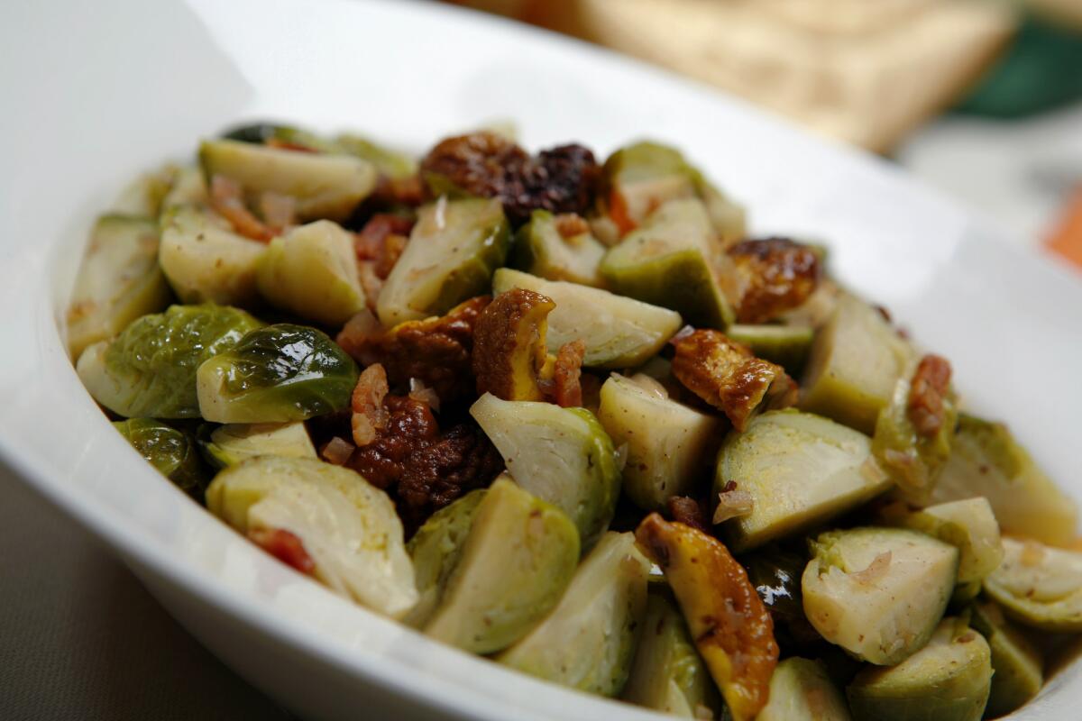 Brussels sprouts braised with bacon and chestnuts are a robust addition to an autumn meal.