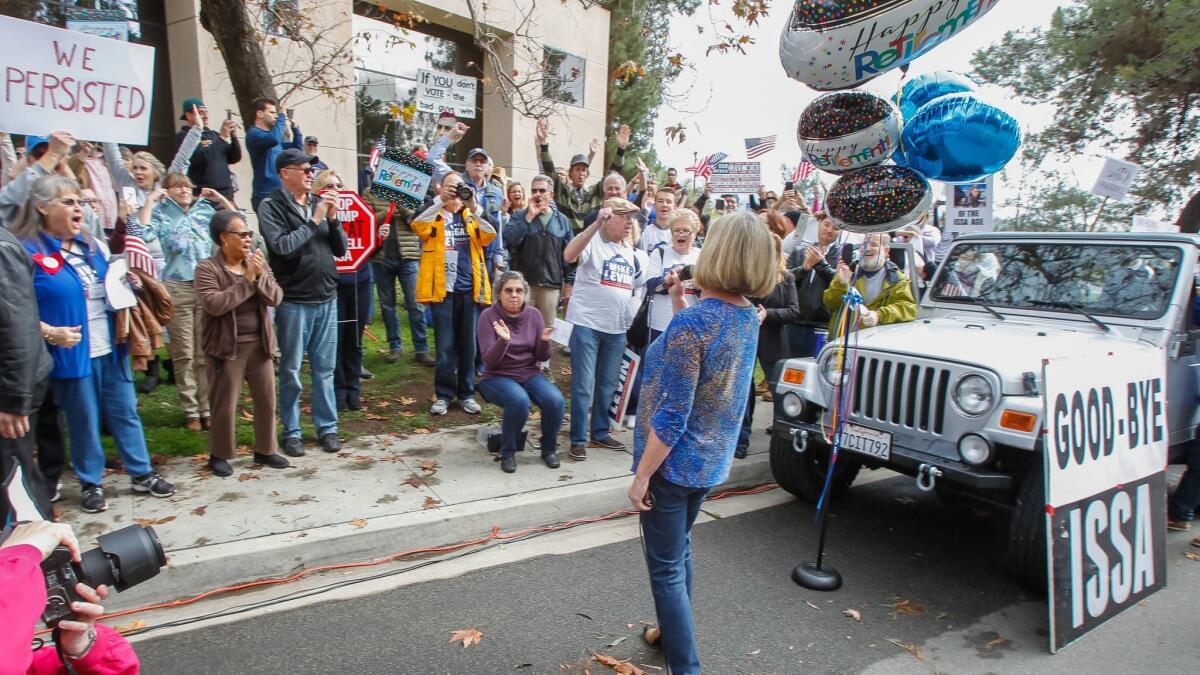 Ellen Montenari chants with the crowd in January, celebrating Issa's announcement he will not seek reelection. (Eduardo Contreras / San Diego Union-Tribune)