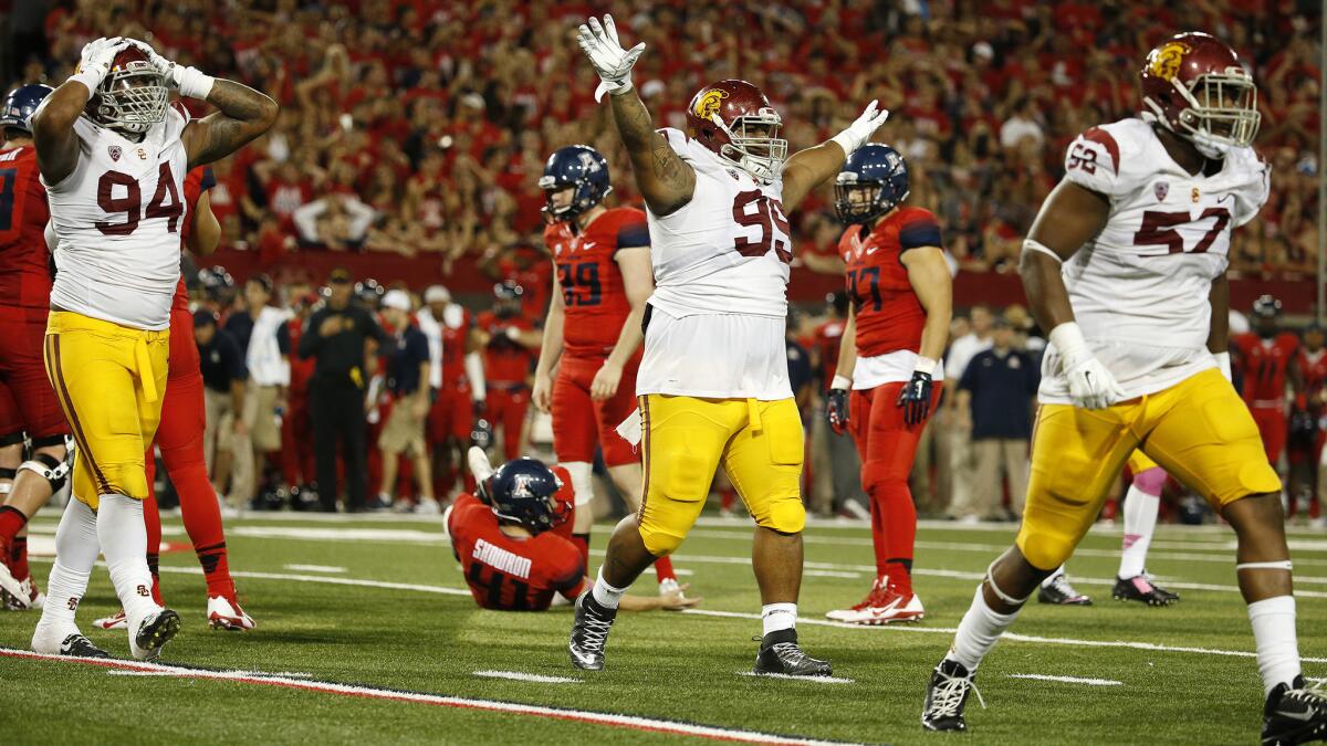 USC has more depth on the defensive line this season, but Antwaun Woods (99) and the Trojans will be without starting defensive ends Leonard Williams (94) and Delvon Simmons (52).