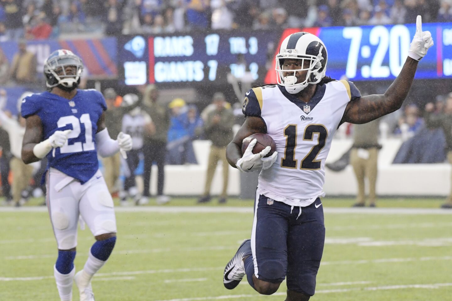 Rams wide receiver Sammy Watkins celebrates as he runs away from Giants safety Landon Collins for a 67-yard touchdown during the first half on Sunday.