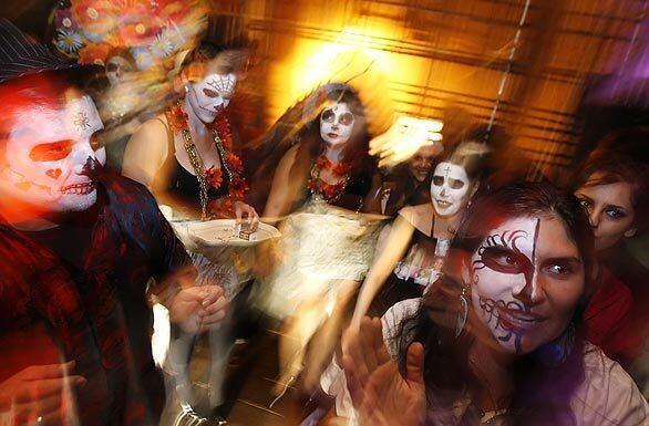 Artists gather backstage at the Tropico de Nopal Gallery Art-Space, preparing to walk the runway together at the Dia de los Muertos Ofrendas 2008 Calavera Fashion Show and Walking Altars.