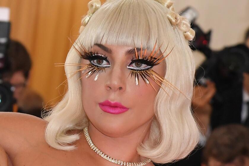Lady Gaga owned the pink carpet with multiple outfit reveals. Her butterfly-like black-and-gold lashes also were a stunner.