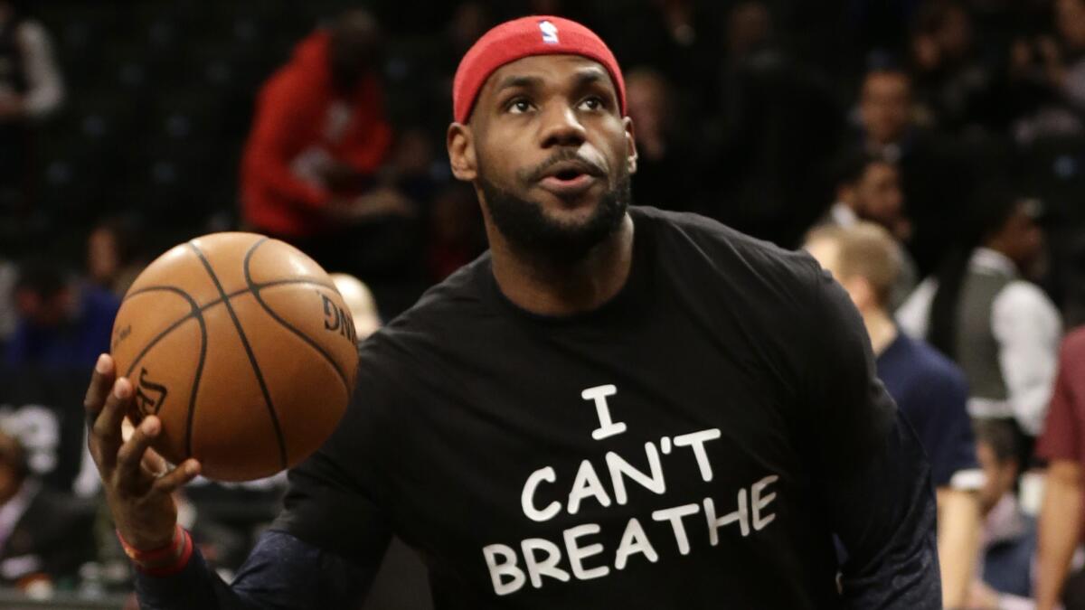 Cleveland Cavaliers forward LeBron James is seen wearing an 'I CAN'T BREATHE' shirt while warming up before a game against the Brooklyn Nets on Monday.