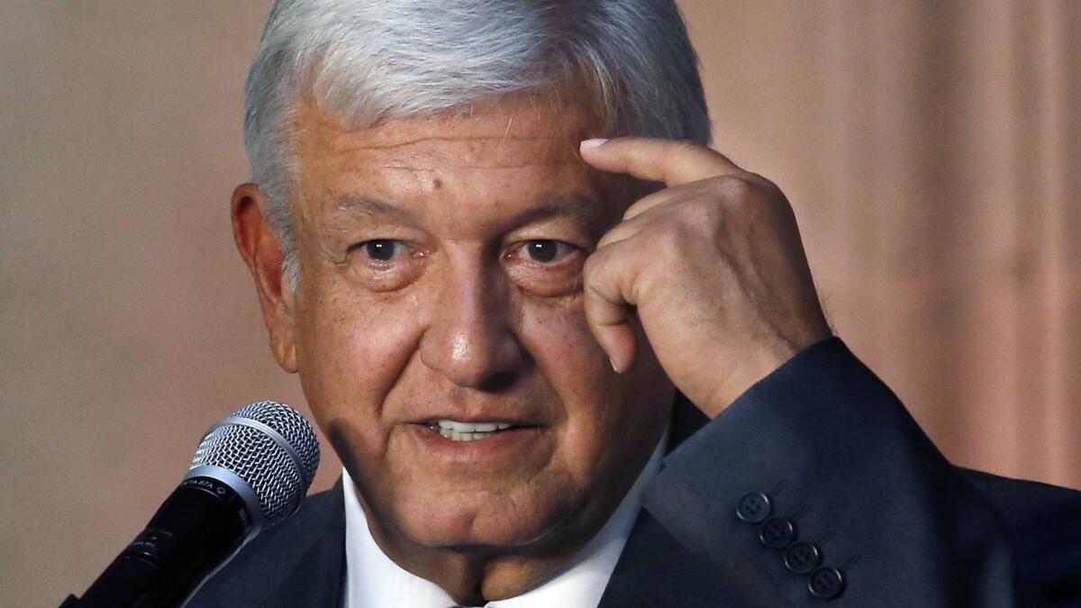 Mexico's President-elect Andres Manuel Lopez Obrador speaks to reporters after meeting with Mexico's President Enrique Peña Nieto at the National Palace in Mexico City on July 3.