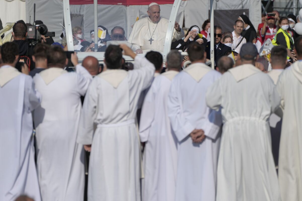 Pope Francis arrives to celebrate a Mass in the esplanade of the National Shrine in Sastin, Slovakia, Wednesday, Sept. 15, 2021. Pope Francis celebrates an open air Mass in Sastin, the site of an annual pilgrimage each September 15 to venerate Slovakia's patron, Our Lady of Sorrows. (AP Photo/Gregorio Borgia)