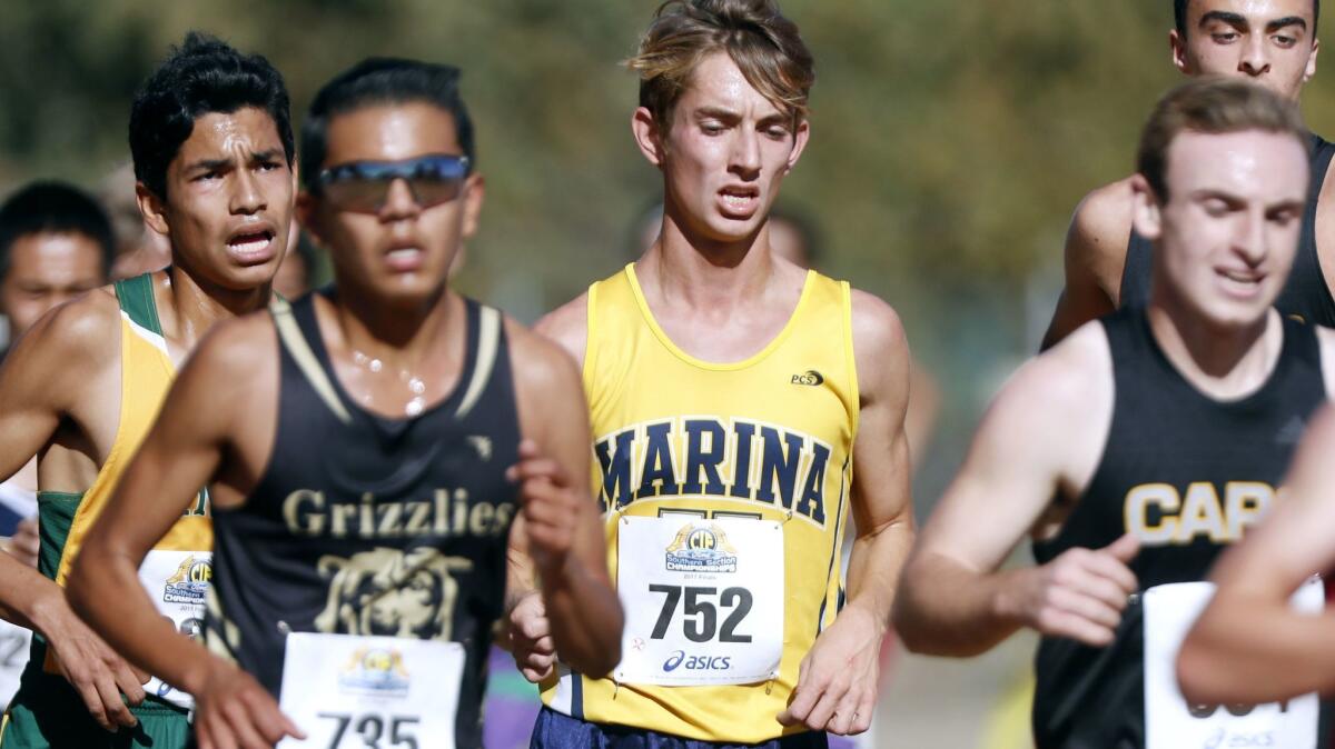 Marina senior Luke Sutherland (752) runs in the CIF Southern Section Division 2 finals on the Riverside City Cross-Country Course on Nov. 18, 2017.