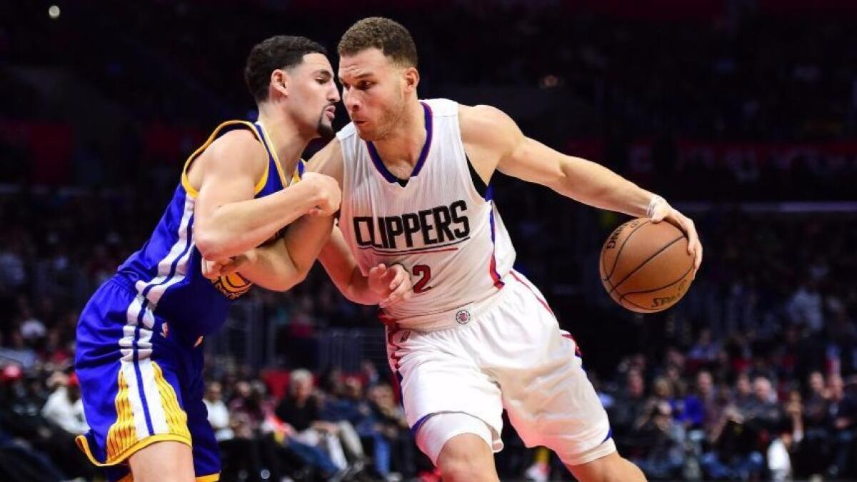 Clippers forward Blake Griffin works in the post against Warriors guard Klay Thompson during a game on Dec. 7.