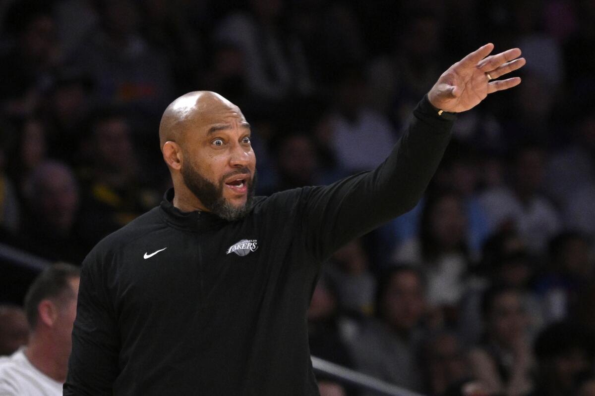 Lakers coach Darvin Ham yells directions to his players from the sideline Friday.