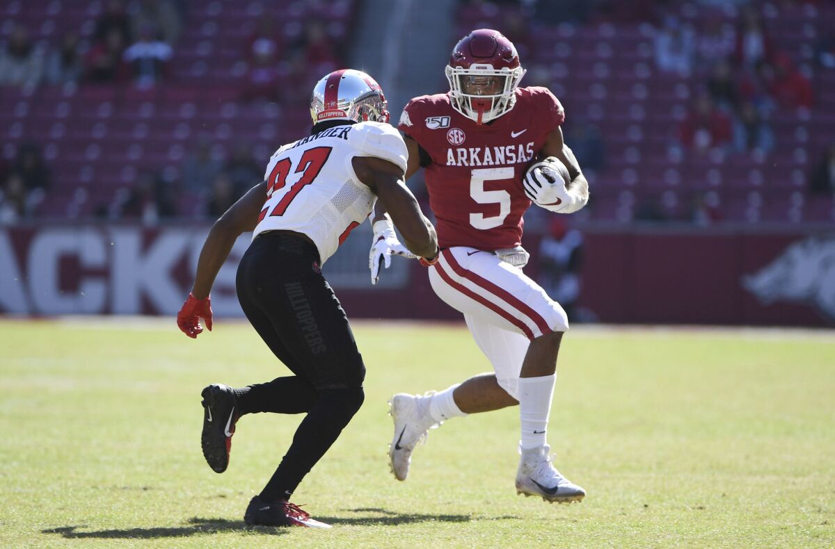 FILE - In this Nov. 9, 2019, file photo, Arkansas running back Rakeem Boyd carries against Western Kentucky during the second half of an NCAA college football game in Fayetteville, Ark. After a promising 2018, Boyd was a breakout star in the Southeastern Conference with 1,133 yards rushing and eight touchdowns last season. (AP Photo/Michael Woods, File)