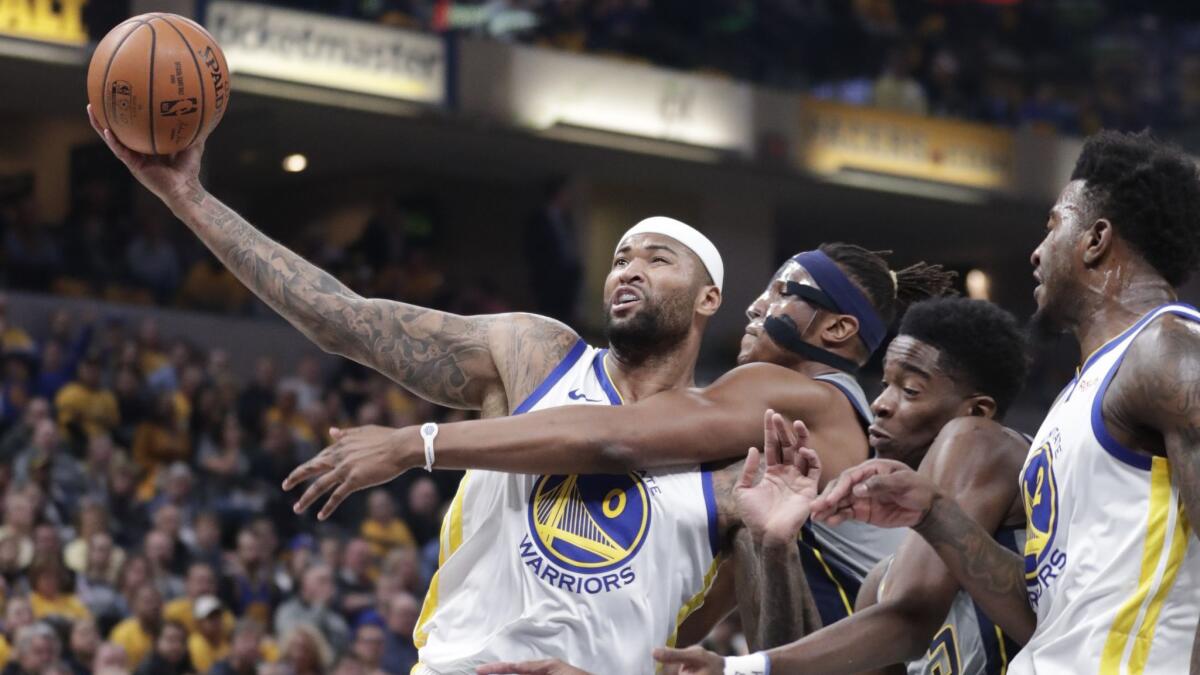 Golden State Warriors center DeMarcus Cousins (0) is fouled by Indiana Pacers center Myles Turner (33) during the first half.