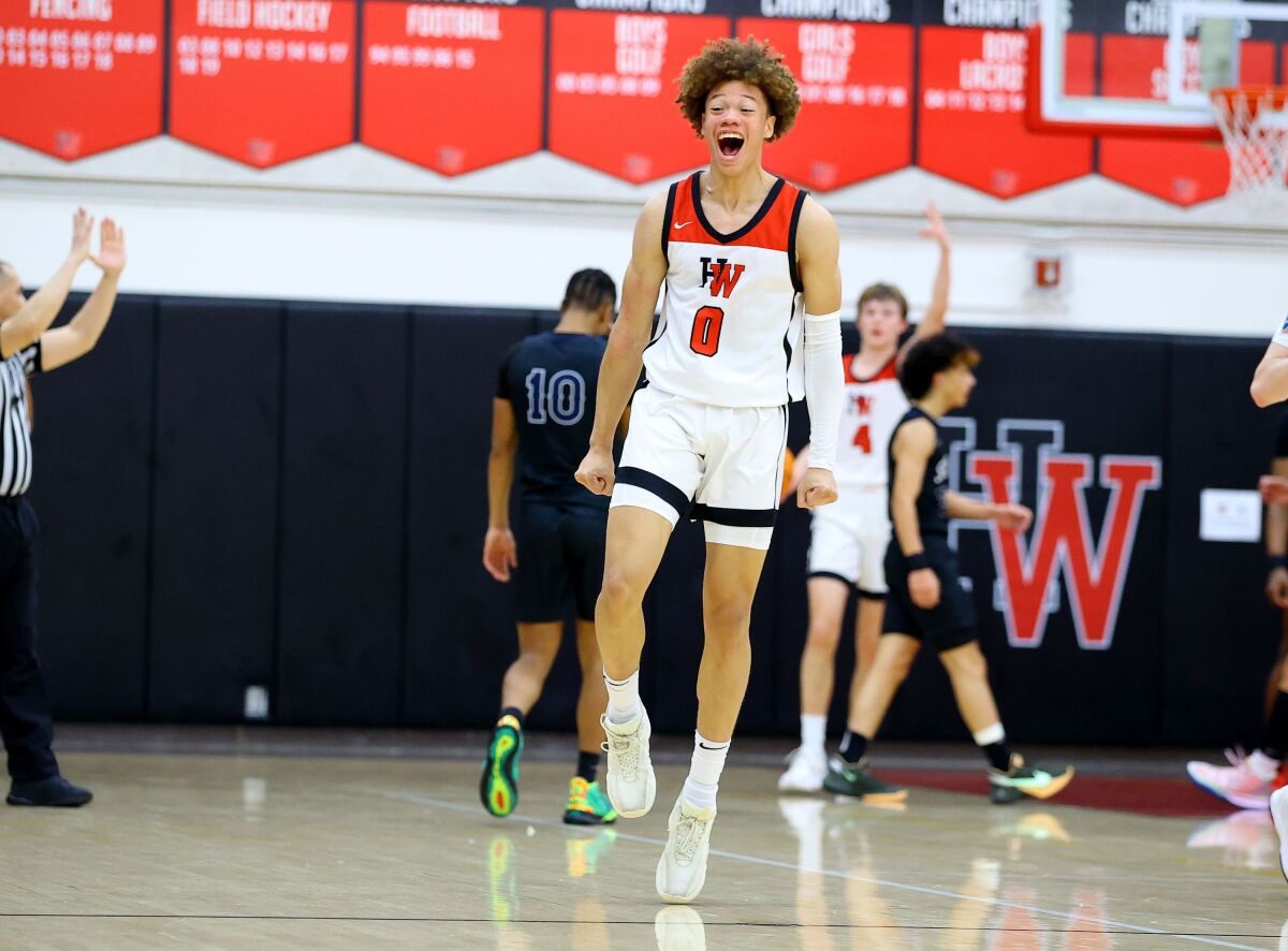 Junior guard Trent Perry of Harvard-Westlake yells after making a three-point shot.