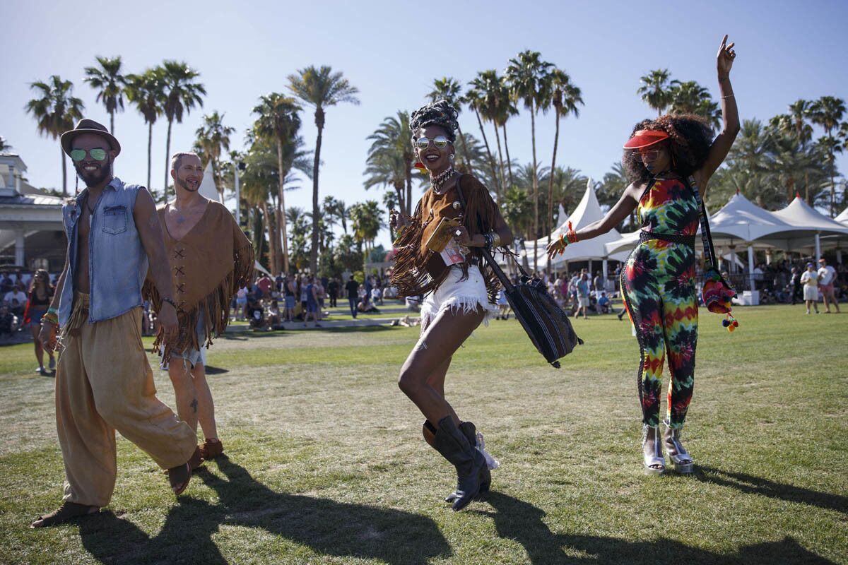 Joalicia Hardy, center, and Britni Calaway, right, of New Jersey dance during weekend one of the three-day Coachella Valley Music and Arts Festival at the Empire Polo Grounds on Friday, April 14, 2017 in Indio, Calif. (Patrick T. Fallon/ For The Los Angeles Times)