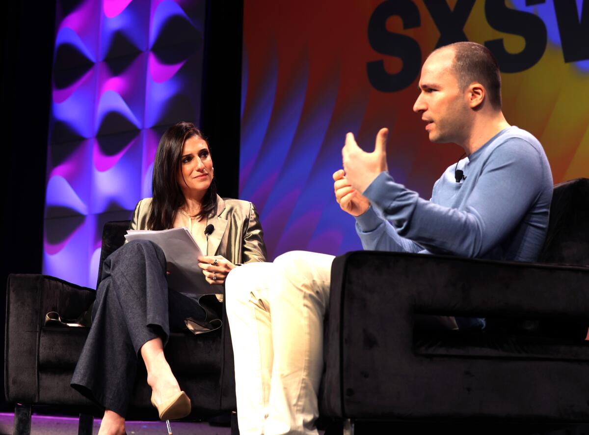 Greg Brockman and Laurie Segall speak onstage during the 2023 SXSW conference.