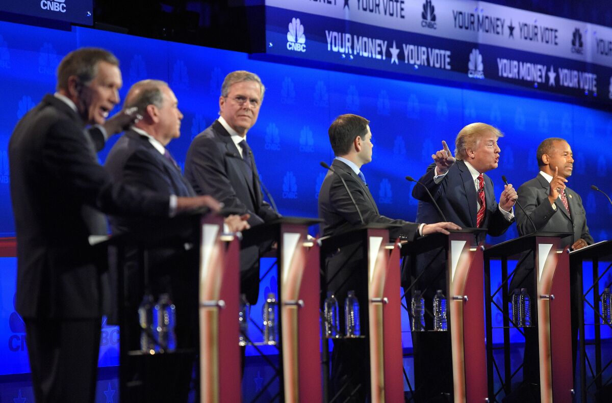 FILE - From left, Ohio Gov. John Kasich, former Arkansas Gov. Mike Huckabee, former Florida Gov. Jeb Bush, Sen. Marco Rubio, R-Fla., Donald Trump and Ben Carson, participate in a debate for Republican presidential hopefuls in Boulder, Colo., Oct. 28, 2015. It's been more than seven years since the 2016 presidential campaign, and Republicans are still trying to figure out how to run against Donald Trump. (AP Photo/Mark J. Terrill, File)