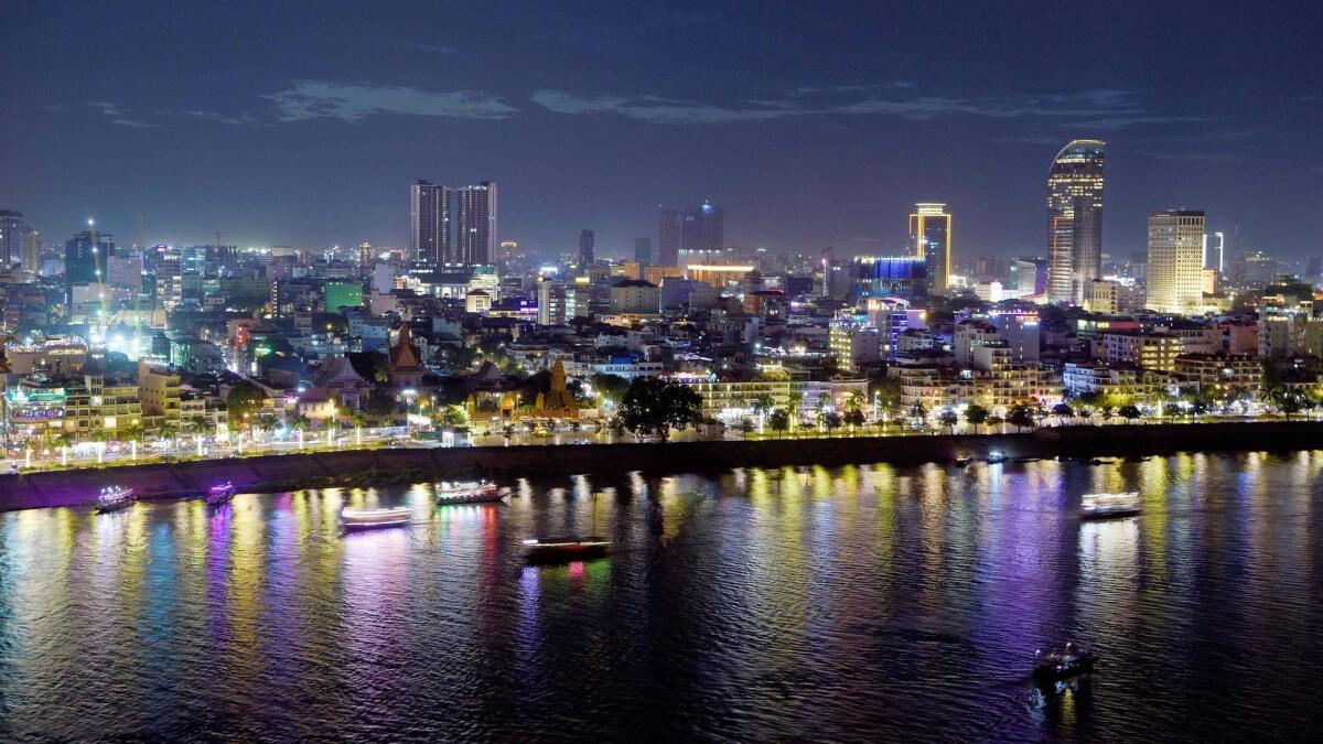 An aerial view of the city skyline at dusk in Phnom Penh, Cambodia.