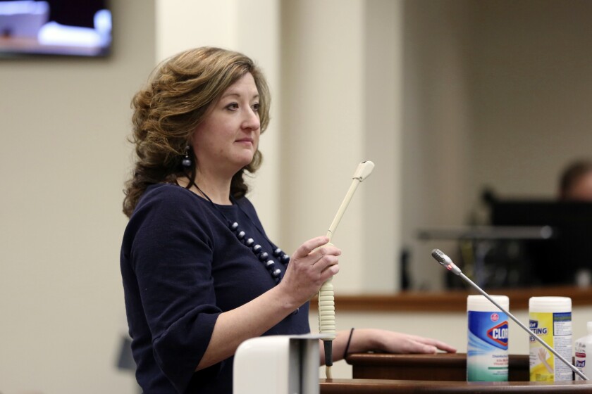 Melissa Anne "Mac" Cunningham-Sereque shows the wand used to do ultrasound on pregnant women during a South Carolina House subcommittee hearing on an abortion bill on Wednesday, Feb. 3, 2021, in Columbia, S.C. The bill would outlaw almost all abortions in the state. (AP Photo/Jeffrey Collins)