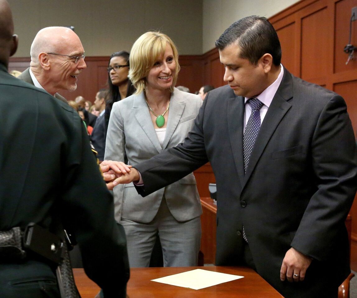 George Zimmerman is congratulated by his defense team after being found not guilty of murder in the shooting death of teenager Trayvon Martin in Sanford, Fla. Zimmerman, a neighborhood watch volunteer, had acknowledged shooting Martin in a gated community but said it was self-defense.