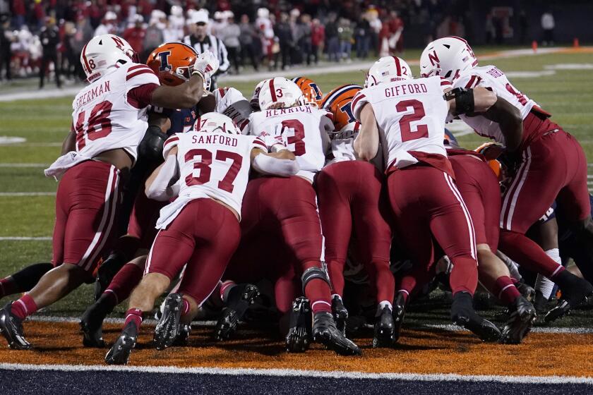 FILE - The Nebraska defense stops Illinois on the 1-yard line during the first half of an NCAA college football game, Friday, Oct. 6, 2023, in Champaign, Ill. Nebraska went from 100th in total defense in 2022 to 11th last season. Defensive coordinator Tony White received a raise from $1 million to $1.6 million per year after his name was connected to three head coach openings. (AP Photo/Charles Rex Arbogast, File)