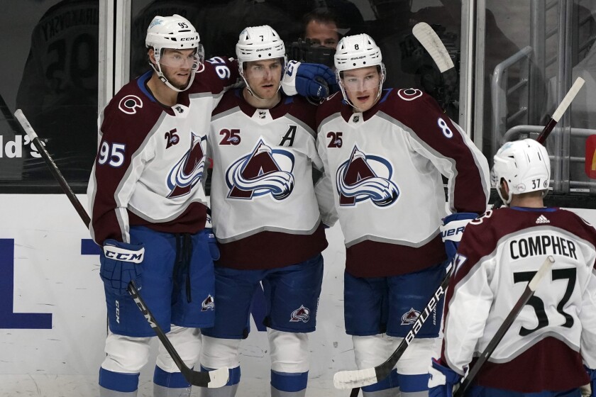 Colorado Avalanche defenseman Devon Toews (7) celebrates his goal with teammates during the first period of an NHL hockey game against the Los Angeles Kings Saturday, May 8, 2021, in Los Angeles. (AP Photo/Marcio Jose Sanchez)