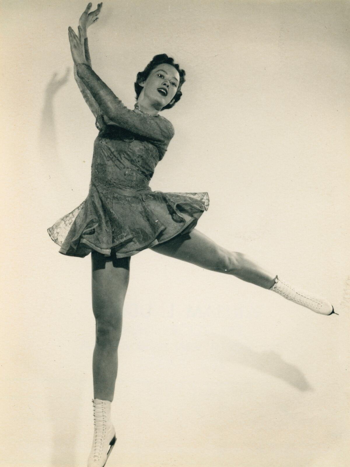 Sandy Sewell, in a photo taken in the 1950s, poses in ice-skating attire.