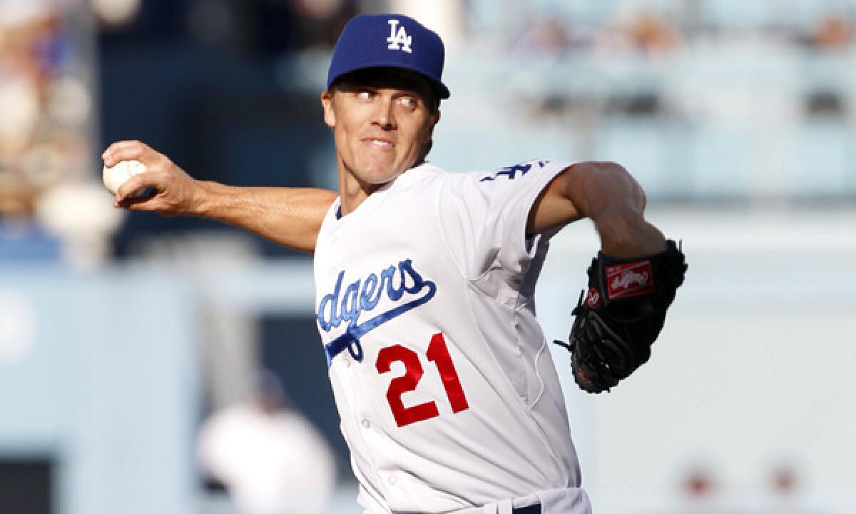 Dodgers starter Zack Greinke delivers a pitch during the first inning of the Dodgers' 6-2 win over the San Francisco Giants on Sunday.