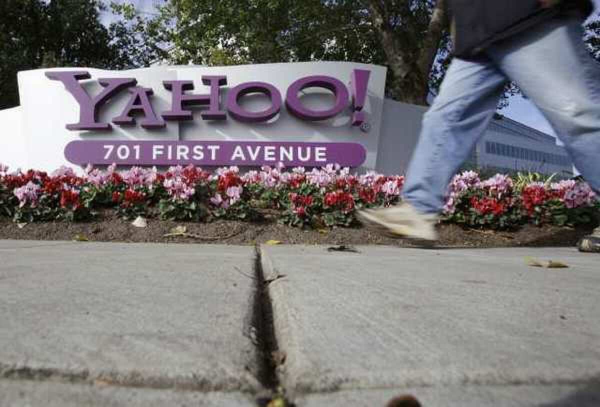 A man walks by Yahoo's headquarters in Sunnyvale, Calif.