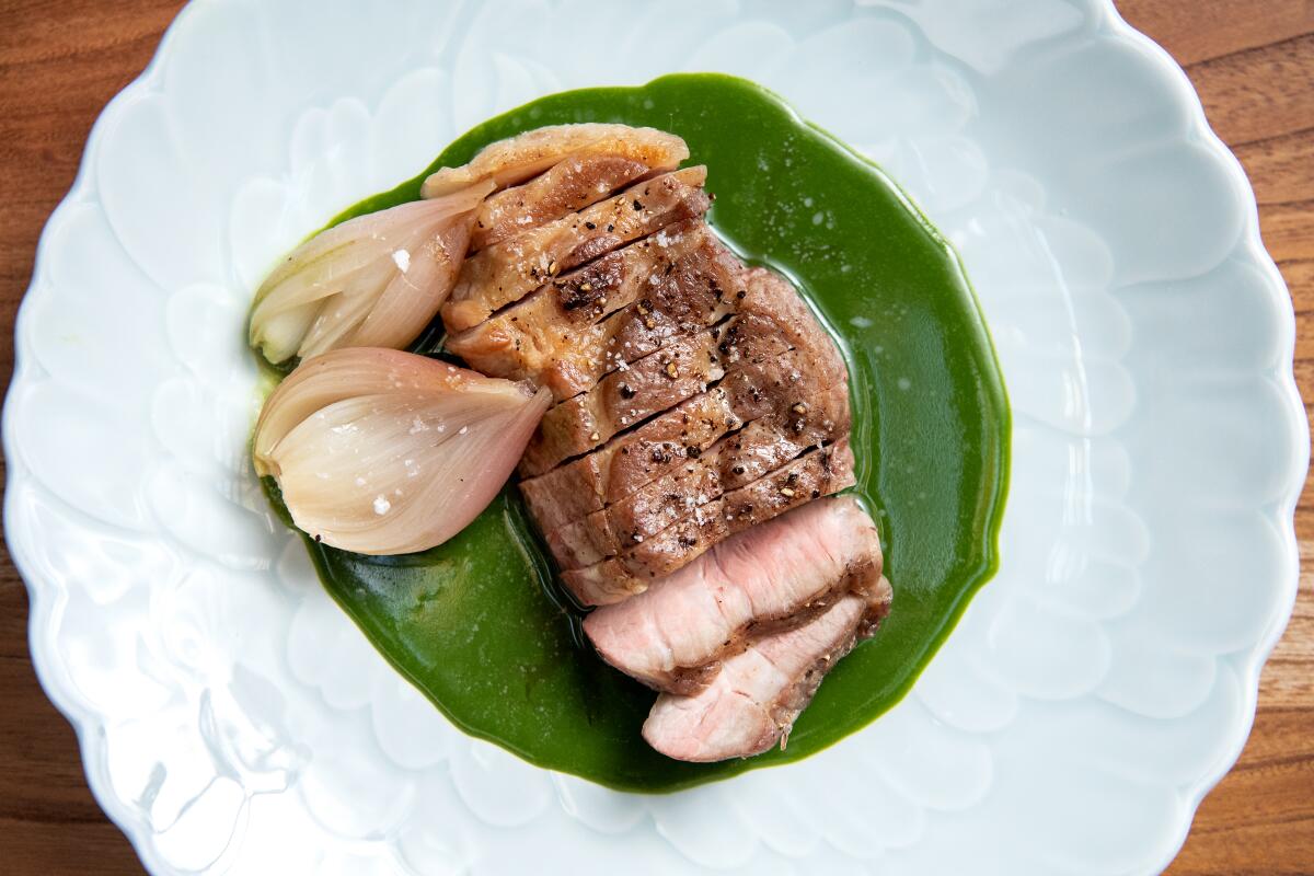 Grilled pork collar with New Zealand spinach from Yess restaurant