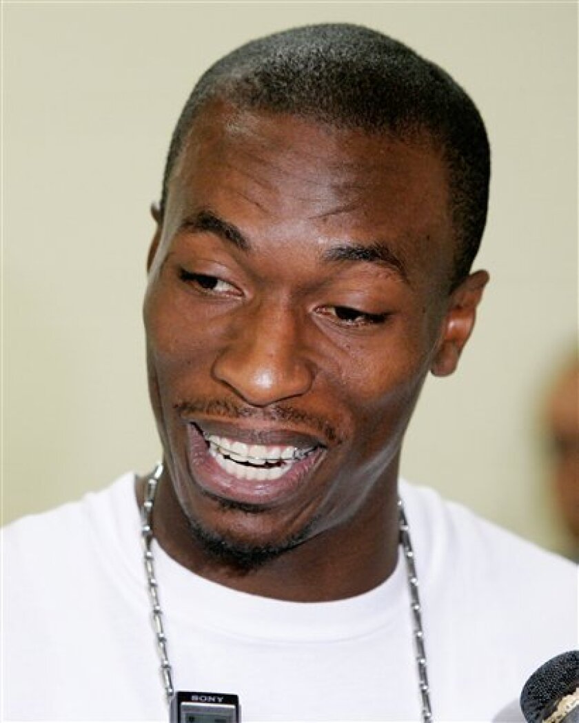In this April 30, 2008 file photo, Dallas Mavericks' Josh Howard smiles as he comments during a news conference in Dallas. Howard took another hit this week in September when an online video surfaced showing the Dallas Mavericks forward disrespecting the national anthem. (AP Photo/Tony Gutierrez, File)
