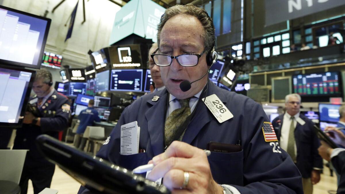 Trader Steven Kaplan works on the floor of the New York Stock Exchange.