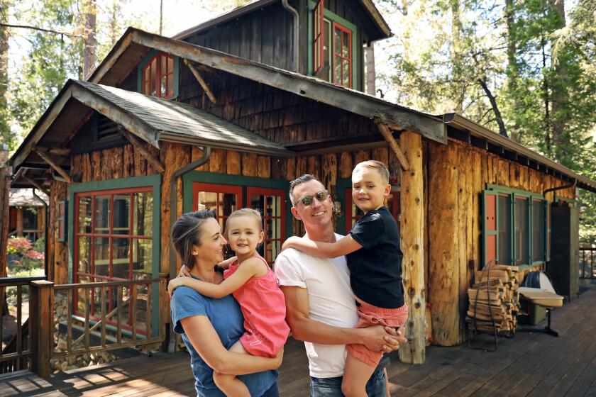 The Donovan family left Silver Lake for Idyllwild after visiting a for-sale home on a lark. The property's two structures date to the early 1920s. Catherine with Bon, age 4, and Michael with Tate, 7.