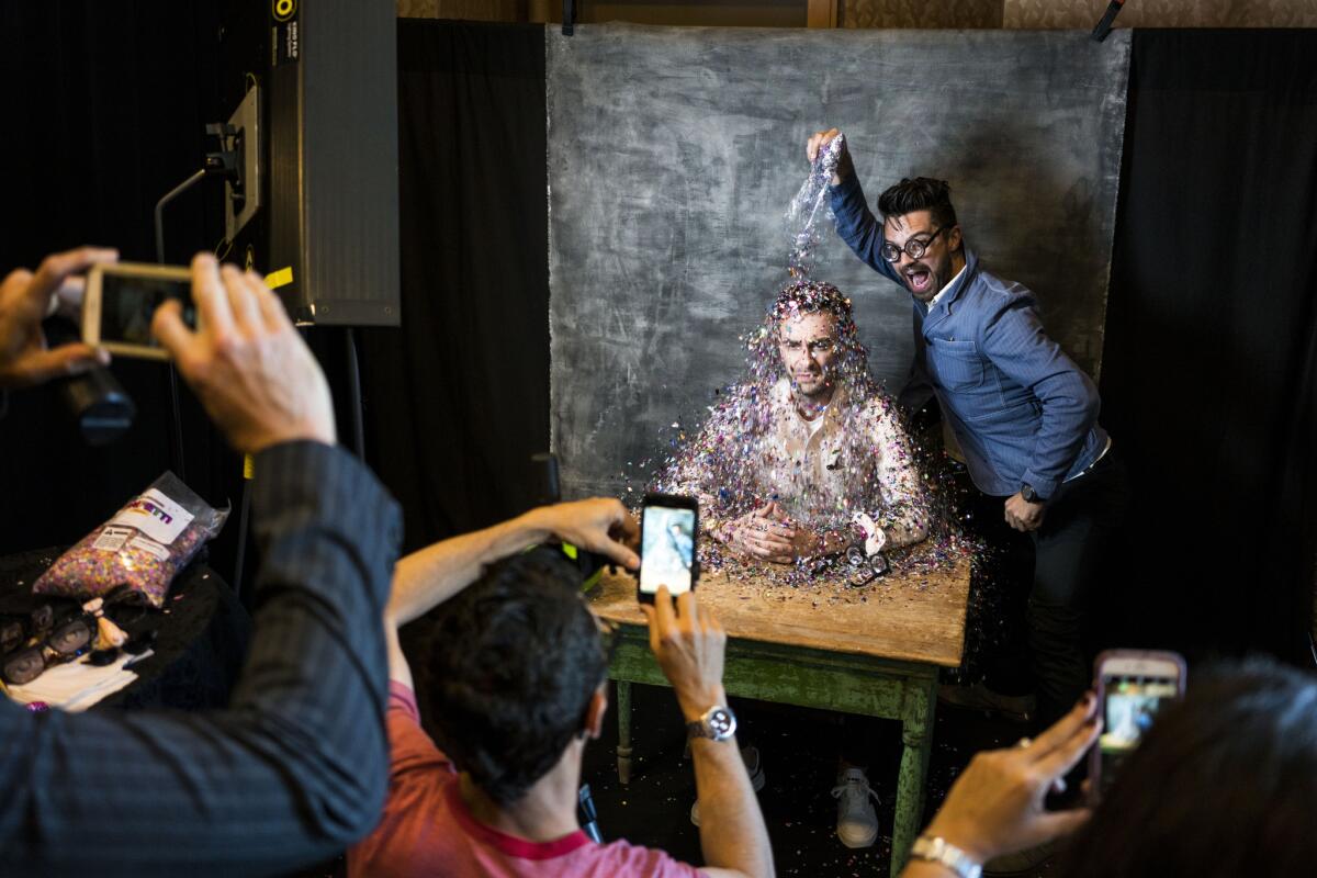 Actors Joseph Gilgun and Dominic Cooper from the television series "Preacher" get into the moment.