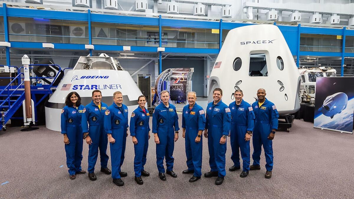 The first U.S. astronauts who will fly to the International Space Station in either Boeing Co. or SpaceX crew capsules. NASA said Thursday that the capsules' first, uncrewed flights will now occur in 2019, instead of this year.