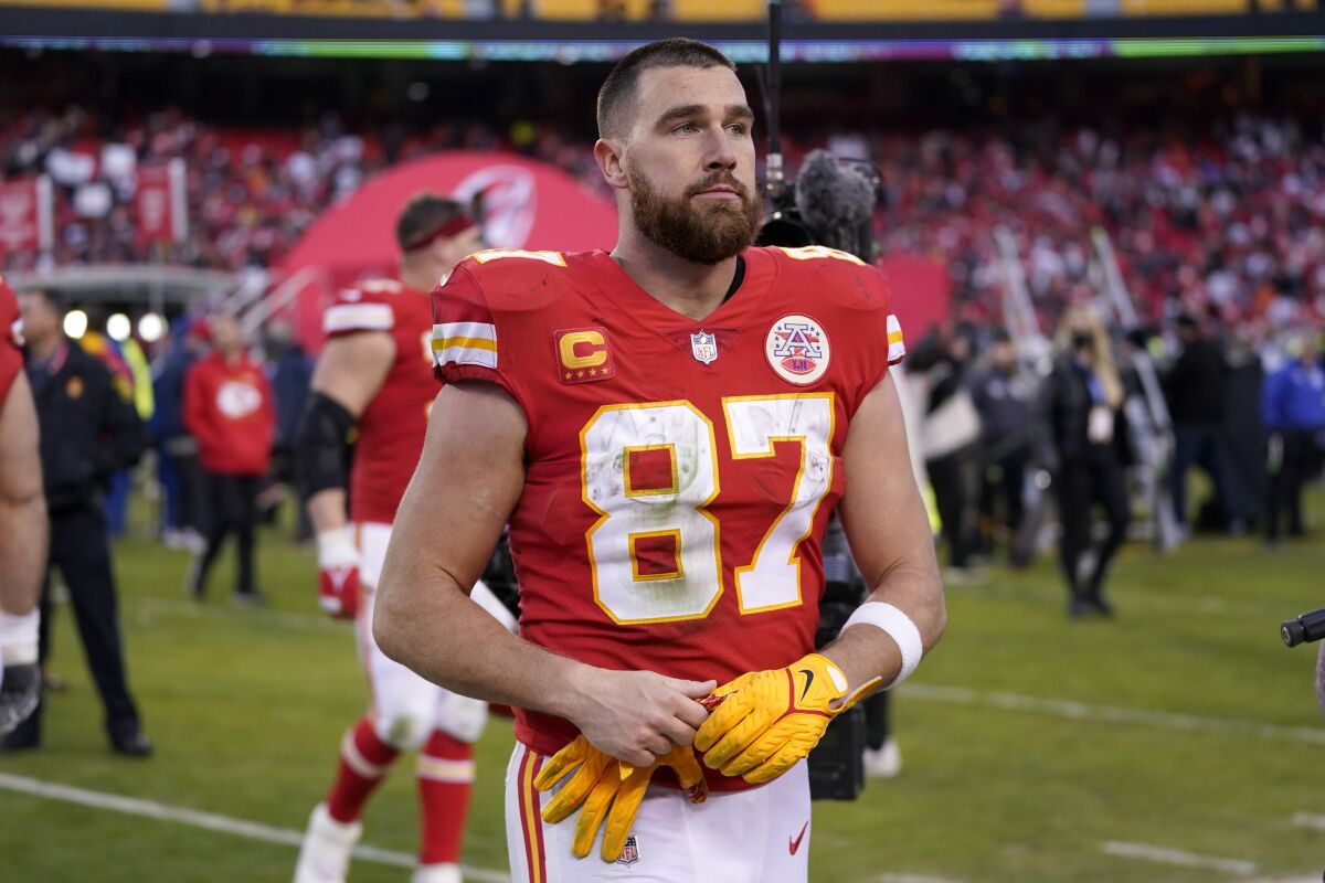 Kansas City Chiefs tight end Travis Kelce walks off the field after the AFC championship NFL football game against the Cincinnati Bengals, Sunday, Jan. 30, 2022, in Kansas City, Mo. The Bengals won 27-24 in overtime. (AP Photo/Paul Sancya)