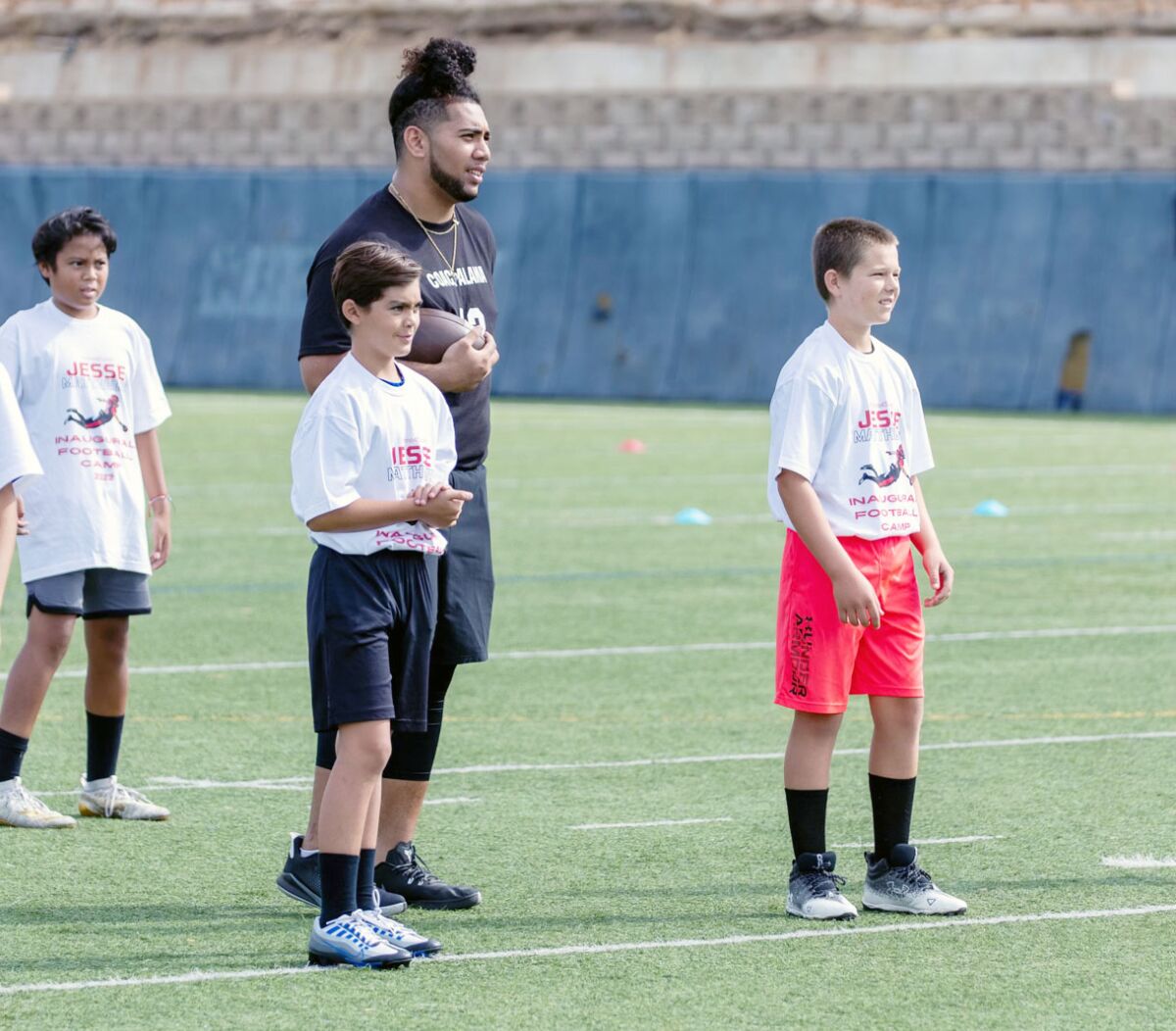 San Diego State center Alama Uluave was among SDSU players who offered instruction at Jesse Matthews football camp.