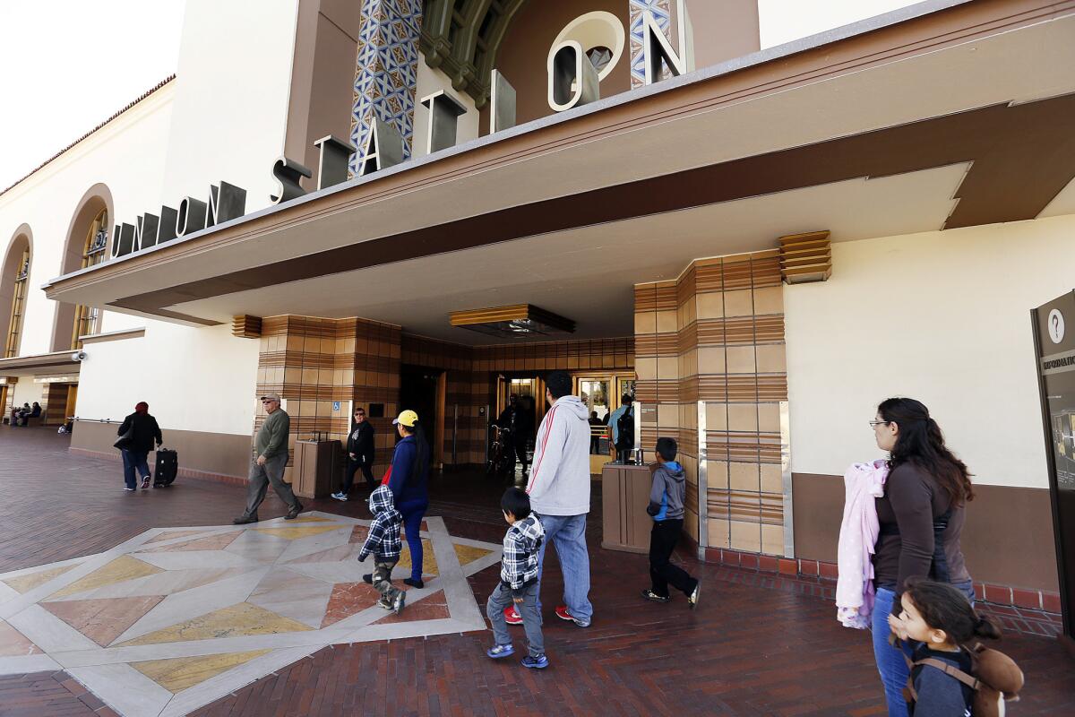 People walk in front of Los Angeles' Union Station.